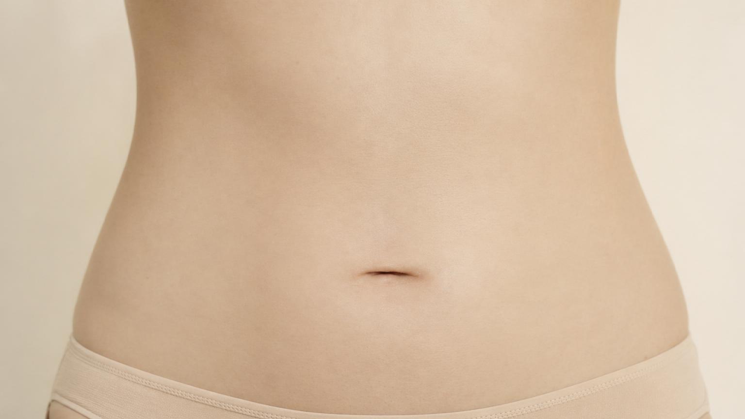 Type 3 horizontal low-set slit belly button — wider than tall and positioned below the natural midline of the abdomen
